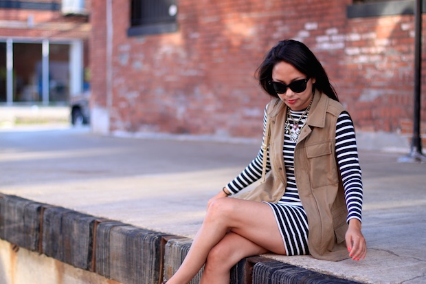 french connection striped dress, cognac booties, utility vest, prada cat eye sunglasses